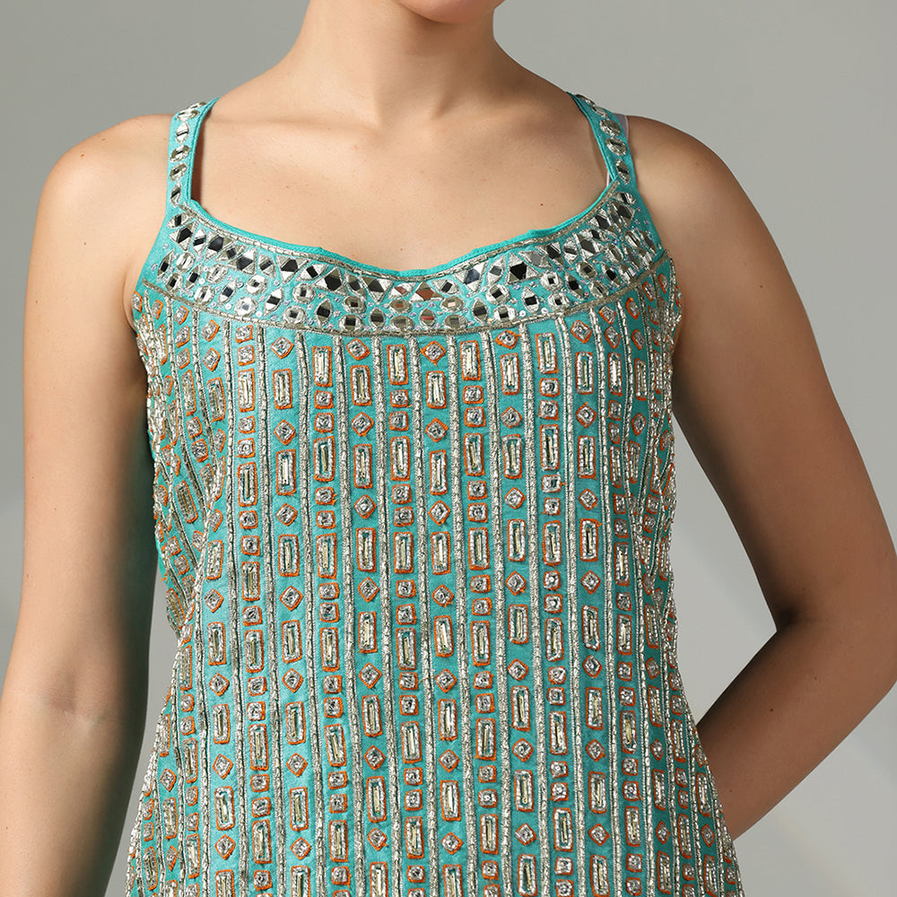 Turquoise Mirror-Work Sharara Set Featuring Contrasting Elements Like A Tangerine Flared Bottom And A Net Dupatta - image 6