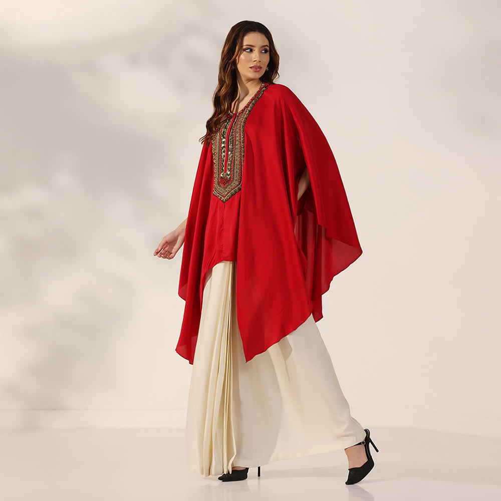 Red Flowing Cape-Style Top With An Embellished Yoke & Asymmetric Draped Sleeves, Paired With An Ivory Draped Skirt - image 3