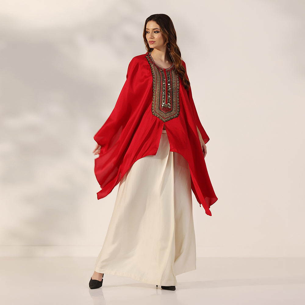 Red Flowing Cape-Style Top With An Embellished Yoke & Asymmetric Draped Sleeves, Paired With An Ivory Draped Skirt - image 4