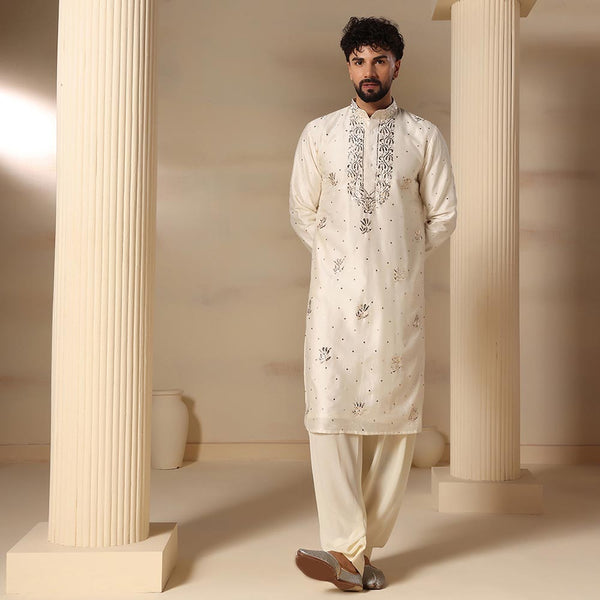 Traditional ivory men's kurta set featuring intricated mukesh embroidery