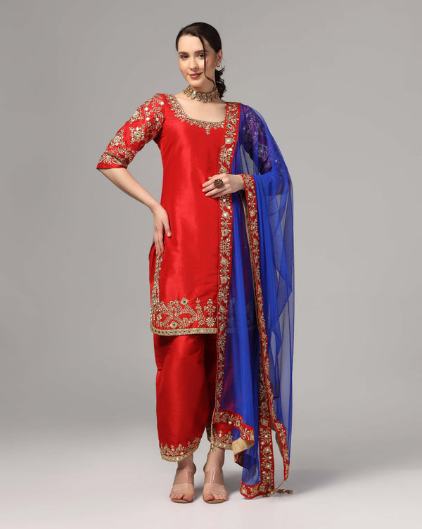 Red Dupion Silk Suit With Blue Dupatta Zari Thread & Mirror Work.