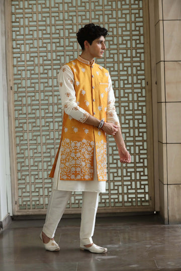 Elegant cream kurta set with vibrant Jacket