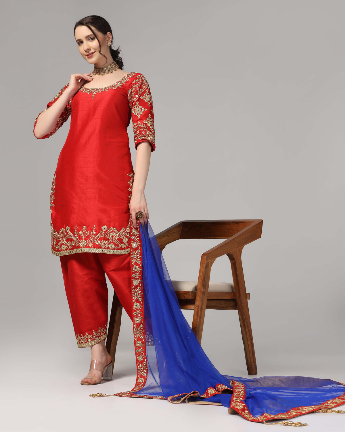 Red Dupion Silk Suit With Blue Dupatta Zari Thread & Mirror Work.