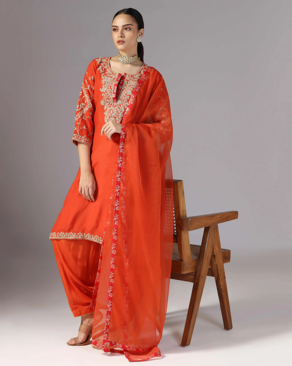 Vibrant Orange Kurta Salwar With Hand Crafted Dori Embroidery