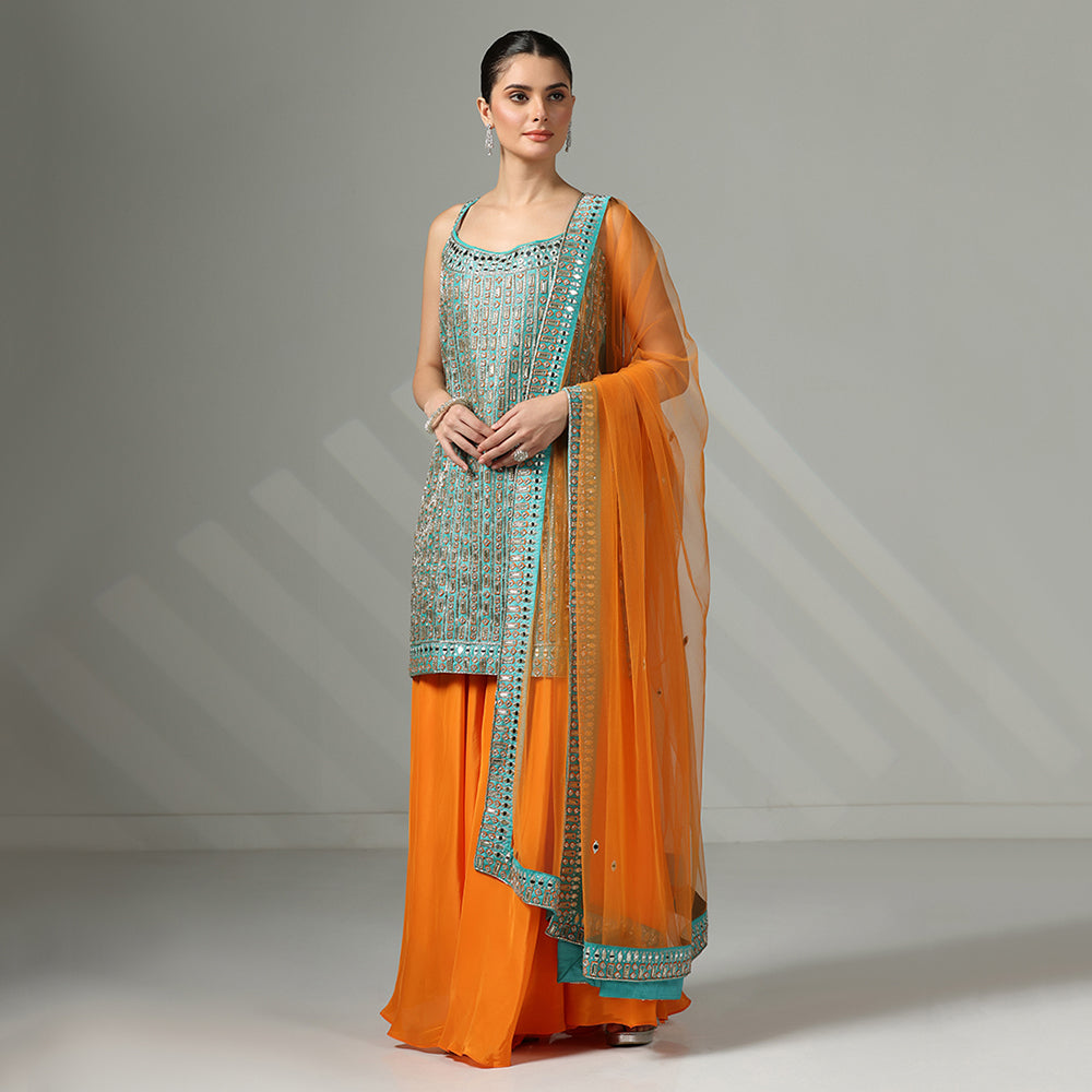 Turquoise Mirror-Work Sharara Set Featuring Contrasting Elements Like A Tangerine Flared Bottom And A Net Dupatta - image 4