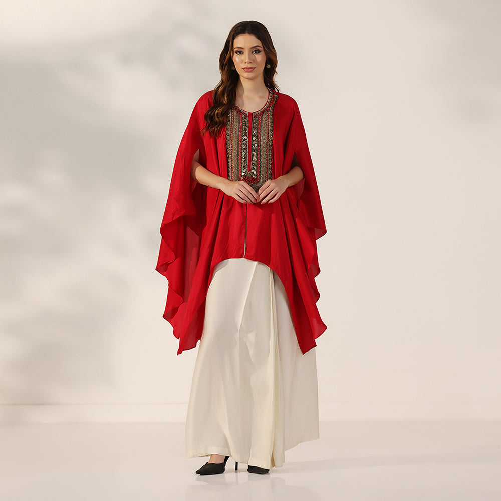 Red Flowing Cape-Style Top With An Embellished Yoke & Asymmetric Draped Sleeves, Paired With An Ivory Draped Skirt - image 1