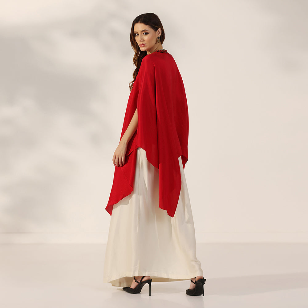 Red Flowing Cape-Style Top With An Embellished Yoke & Asymmetric Draped Sleeves, Paired With An Ivory Draped Skirt - image 5